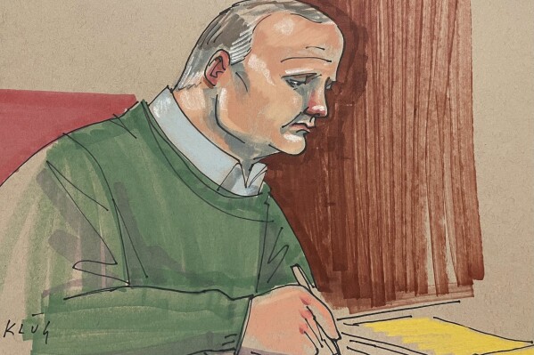 Defendant Robert Bowers takes notes during a sentencing hearing that will determine if he gets a life sentence or the death penalty, in Pittsburgh federal court on Monday, July 31, 2023. Jurors are expected to begin deliberations early Tuesday in the 2018 attack that killed 11 worshippers. (Dave Klug via AP)