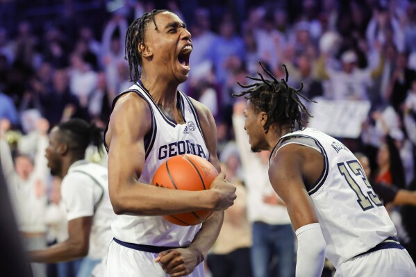 Georgia Tech forward Tafara Gapare, left, and Miles Kelly, right, celebrate after beating North Carolina 74-73 during an NCAA college basketball game Tuesday, Jan. 30, 2024, in Atlanta. (AP Photo/Alex Slitz)