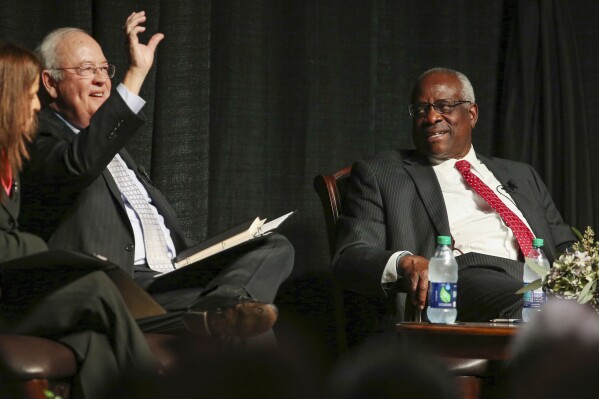 FILE - Former Baylor University president Ken Starr, left, introduces Supreme Court Justice Clarence Thomas, right, to a crowd at McLennan Community College in Waco, Texas, Sept. 7, 2017. (Rod Aydelotte/Waco Tribune-Herald via AP)
