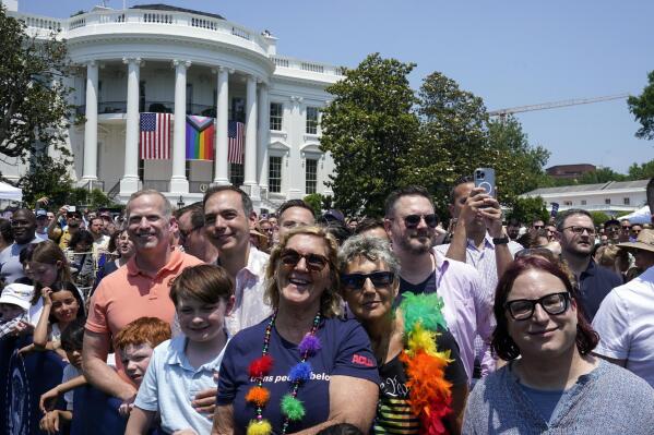 People listen as President Joe Biden speaks at a Pride Month celebration on the South Lawn of the White House, Saturday, June 10, 2023, in Washington. (AP Photo/Manuel Balce Ceneta)