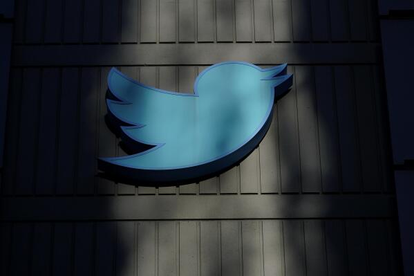 FILE - A sign at Twitter headquarters is shown in San Francisco, Friday, Nov. 18, 2022. Election falsehoods are thriving on Twitter after former President Donald Trump dug in on these claims at a CNN town hall, despite Twitter owner Elon Musk's insistence that false stolen-election claims on the platform “will be corrected.” An analysis shows the 10 most widely shared tweets promoting a “rigged election” narrative in the five days after the town hall have not been labeled or removed. (AP Photo/Jeff Chiu, File)