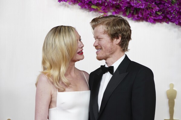 Kirsten Dunst, left, and Jesse Plemons arrive at the Oscars on Sunday, March 10, 2024, at the Dolby Theatre in Los Angeles. (Photo by Jordan Strauss/Invision/AP)