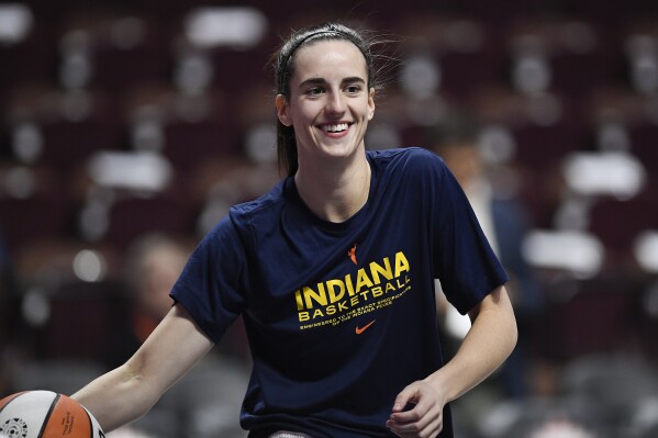 Indiana Fever guard Caitlin Clark warms up before playing against the Connecticut Sun, Tuesday, May 14, 2024, Uncasville, Conn. (AP Photo/Jessica Hill)