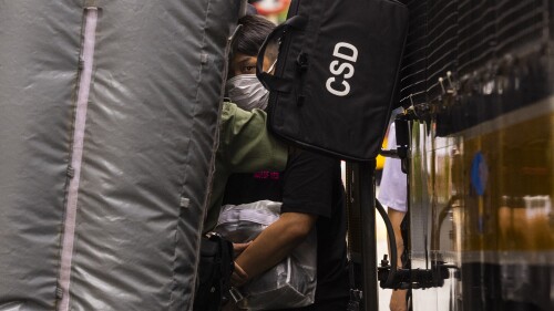 Detained activist Jimmy Sham, center, leaves a prison van to enter the Court of Final Appeal as Hong Kong's top court hear the activist's last bid to ask for recognition of his New York-registered same-sex marriage in Hong Kong, Wednesday, June 28, 2023. (AP Photo/Louise Delmotte)