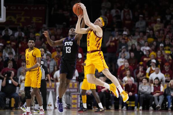 Iowa State guard Caleb Grill (2) is fouled by TCU guard Shahada Wells (13) during the second half of an NCAA college basketball game, Wednesday, Feb. 15, 2023, in Ames, Iowa. (AP Photo/Charlie Neibergall)