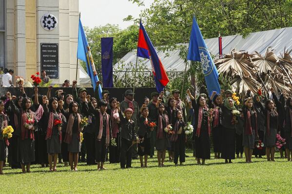 Cambodian students from Royal University of Fine Arts perform the Victory Day dancing during their reign of terror in the 1970s in an event hosted by the ruling Cambodian People's Party to mark the annual of Remembrance Day at Choeung Ek, a former Khmer Rouge "killing field," on the outskirt of Phnom Penh, Cambodia Tuesday, May 20, 2025. (AP Photo/Heng Sinith)