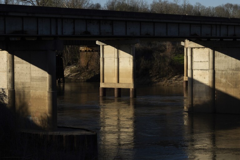 The Trinity River is seen near where law enforcement found the body of 11-year-old Audrii Cunningham, Tuesday, Feb. 20, 2024, in Livingston, Texas. Divers have recovered the body Cunningham days after the girl went missing, and authorities are preparing to file a murder charge against a friend of her father who lived on her family’s property, a sheriff said Tuesday afternoon. (Jason Fochtman/Houston Chronicle via AP)