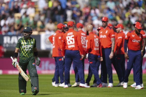 Pakistan's Muhammad Rizwan leaves the field after being caught out by England's Liam Livingstone during the second IT20 match at Edgbaston, Birmingham, England, Saturday May 25, 2024. (Bradley Collyer/PA via AP)