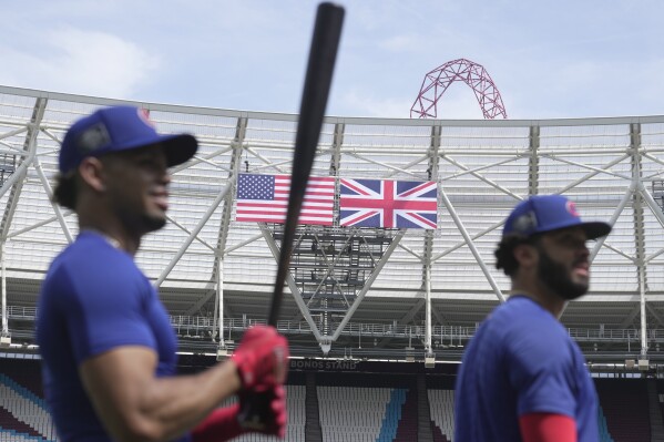 FILE - Chicago Cubs' team players practice during a training session ahead of the baseball match against St. Louis Cardinals at the MLB World Tour London Series, in London Stadium. Major League Baseball returns to London this weekend, June 8-9, 2024, when the New York Mets and Philadelphia Phillies play a two-game set. It's the third time in the past five years that MLB has brought “America's Pastime” to London Stadium. (AP Photo/Kin Cheung, File)