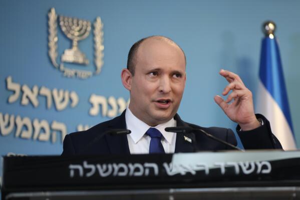 FILE - Israeli Prime Minister Naftali Bennett speaks during a news conference regarding COVID-19 pandemic in the country on Wednesday, Aug. 18, 2021 in Jerusalem. Bennett departed Tuesday, Aug. 24, 2021 for his first state visit overseas since taking office, a two-day trip to Washington to meet with President Joe Biden and discuss regional rival Iran. (Abir Sultan/Pool Photo via AP, file)