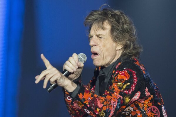 
              FILE - In this Oct. 22, 2017 file photo, Mick Jagger of the Rolling Stones performs during the concert of their 'No Filter' Europe Tour 2017 at U Arena in Nanterre, outside Paris, France. The Rolling Stones are postponing their latest tour so Jagger can receive medical treatment.  The band announced Saturday, March 30, 2019 that Jagger “has been advised by doctors that he cannot go on tour at this time.” The band added that Jagger “is expected to make a complete recovery so that he can get back on stage as soon as possible.”  (AP Photo/Michel Euler, File)
            