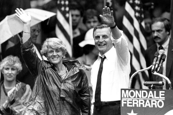 FILE - In this Wednesday, Sept. 5, 1984, file photo, Democratic presidential candidate Walter Mondale and his running mate, Geraldine Ferraro, wave as they leave an afternoon rally in Portland, Ore. Mondale, a liberal icon who lost the most lopsided presidential election after bluntly telling voters to expect a tax increase if he won, died Monday, April 19, 2021. He was 93. (ĢӰԺ Photo/Jack Smith, File)