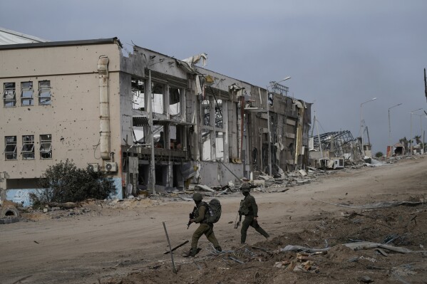 UPDATES INSTRUCTIONS - Israeli soldiers are seen during a ground operation in the Gaza Strip, Wednesday, Nov. 22, 2023. (AP Photo/Victor R. Caivano)