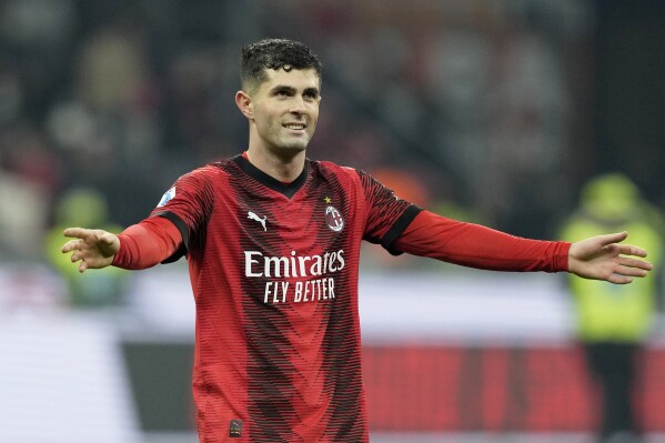 AC Milan's Christian Pulisic smiles at the end of the Serie A soccer match between AC Milan and Sassuolo at the San Siro stadium, in Milan, Italy, Saturday, Dec. 30, 2023. Pulisic scored the goal in Milan's 1-0 win. (AP Photo/Antonio Calanni)