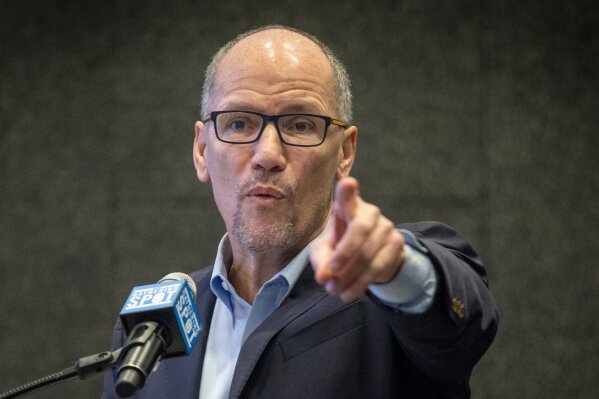 FILE - In this Nov. 20, 2019 file photo, Tom Perez, chair of the Democratic National Committee, addresses the audience during a speech in Atlanta. Perez said Monday that the handful of 2020 presidential caucuses should be the last the party ever holds.  He didn’t specifically name Iowa, which for decades has led off the nominating calendar, but his position would represent a seismic shift in the party’s traditions. (AP Photo/ Ron Harris)