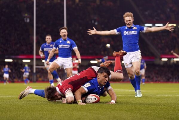 Italy's Lorenzo Pani scores a try during the Six Nations rugby union international match between Wales and Italy, at the Principality Stadium in Cardiff, Wales, Saturday March 16, 2024. (Joe Giddens/PA via AP)