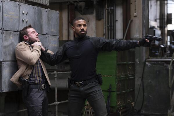 This image released by Amazon shows Jamie Bell , left, and Michael B. Jordan in a scene from "Tom Clancy's Without Remorse." (Nadja Klier/Amazon via AP)