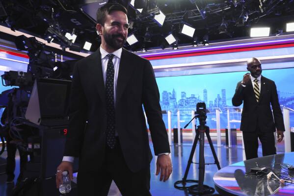 Democratic mayoral candidates Zohran Mamdani, left, and Michael Blake leave the WNBC studio after participating in a Democratic mayoral primary debate, Wednesday, June 4, 2025, in New York. (AP Photo/Yuki Iwamura, Pool)