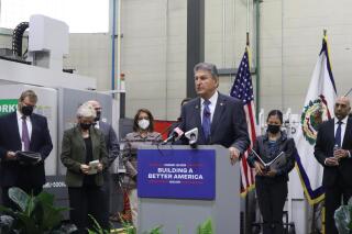 U.S. Democratic Sen. Joe Manchin of West Virginia speaks during a press conference at the Robert C. Byrd Institute at Marshall University’s campus in Charleston, W.Va., on Friday, March 18, 2022. The press conference was to announce on the startup SPARKZ’s new electric battery factory slated to come to West Virginia later this year. (AP Photo/Leah M. Willingham)