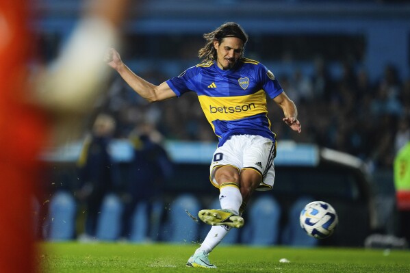 Edinson Cavani of Argentina's Boca Juniors scores during a penalty shootout at the end of Copa Libertadores quarterfinal second leg soccer match against Argentina's Racing Club at Presidente Peron stadium in Buenos Aires, Argentina, Wednesday, Aug. 30, 2023. Boca Juniors won 4-1 in a penalty shootout. (AP Photo/Natacha Pisarenko)