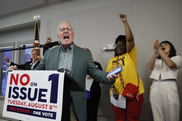 Dennis Willard, spokesperson for One Person One Vote, celebrates the results of the election during a watch party Tuesday, Aug. 8, 2023, in Columbus, Ohio. Ohio voters have resoundingly rejected a Republican-backed measure that would have made it more difficult to pass abortion protections. (AP Photo/Jay LaPrete)