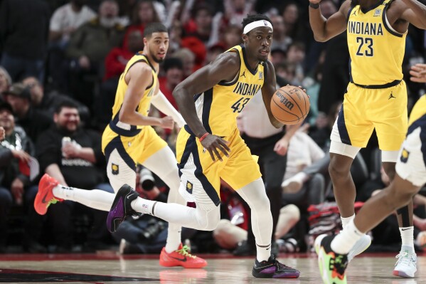 Grant scores 37 points and Trail Blazers down Pacers 118-115 to spoil  Siakam's debut