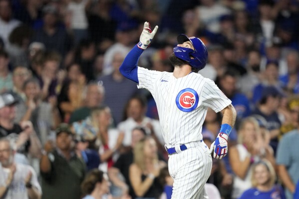 Chicago Cubs' Dansby Swanson celebrates his two-run home run off Cincinnati Reds starting pitcher Ben Lively, Swanson's second home run of the baseball game, during the fourth inning Tuesday, Aug. 1, 2023, in Chicago. (AP Photo/Charles Rex Arbogast)