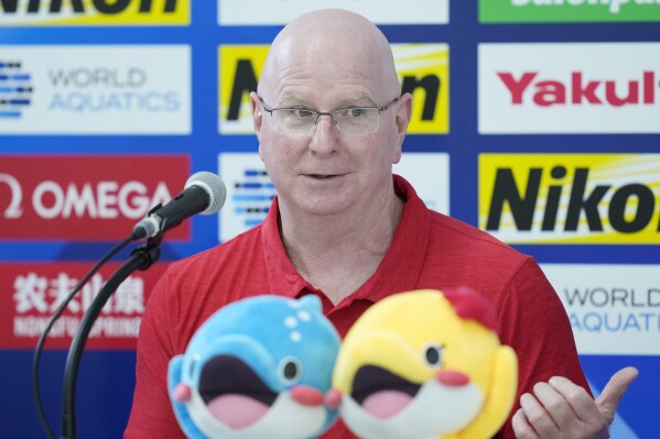 FILE - U.S. head coach Bob Bowman speaks during a news conference at the World Swimming Championships in Fukuoka, Japan, Friday, July 21, 2023. Legendary swimming coach Bowman keeps turning out winners. He is best known for helping American Michael Phelps to 23 Olympic gold medals. He's the swim coach at Arizona State University, and he's also coaching the American team at this year's world championships in Japan. (AP Photo/Eugene Hoshiko, File)