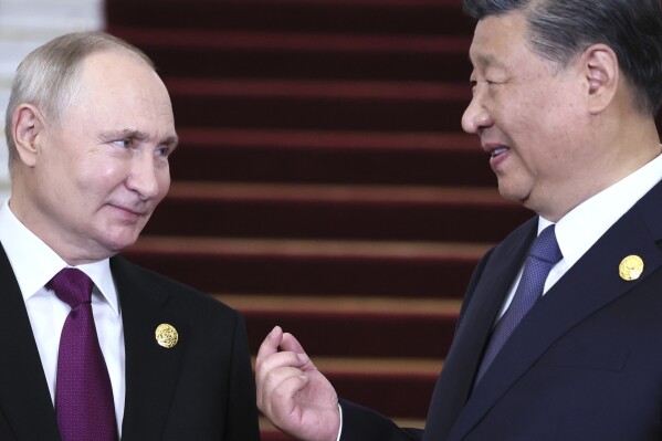 Russian President Vladimir Putin, left, and Chinese President Xi Jinping talk during their meeting on the sidelines of the Belt and Road Forum in Beijing, China, on Tuesday, Oct. 17, 2023. (Sergey Savostyanov, Sputnik, Kremlin Pool Photo via AP)