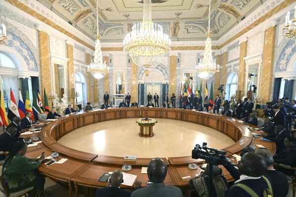 FILE - In this handout photo provided by Photo host Agency RIA Novosti, Russian President Vladimir Putin, at left, attends a meeting with a delegation of African leaders and senior officials in St. Petersburg, Russia, Saturday, June 17, 2023. By halting a landmark deal that allowed Ukrainian grain exports via the Black Sea, Putin has taken a risky gamble that could badly damage Moscow's relations with many of its partners that have remained neutral or even supportive of the Kremlin amid the war in Ukraine. Russia has also played spoiler at the United Nations, vetoing a resolution on extending humanitarian aid deliveries via a key crossing point in northwestern Syria and backing Mali's push to expel the U.N. peacekeepers. Putin's decision to spike the deal could backfire against Russia's own interests, straining Moscow's relations with key partner Turkey and hurting its ties with African countries. (Pavel Bednyakov/Photo host Agency RIA Novosti via AP, File)