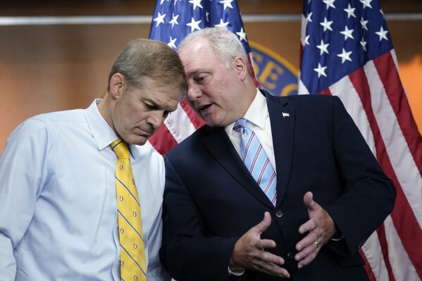 FILE—Rep. Jim Jordan, R-Ohio, left, and Rep. Steve Scalise, R-La., confer during a news conference at the Capitol in Washington, Wednesday, June 8, 2022. The two GOP leaders have emerged as contenders to replace former House Speaker Kevin McCarthy who was voted out of the job by a contingent of hard-right conservatives. Jordan is now chairman of the House Judiciary Committee and a staunch ally of former President Donald Trump. House Majority Leader Steve Scalise, R-La., has long sought the top post. (AP Photo/J. Scott Applewhite, File)