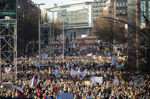 Anti right-wing demonstrators take part in a protest in Hamburg, Germany, Sunday, Jan. 28, 2024. (Jonas Walzberg/dpa via AP)