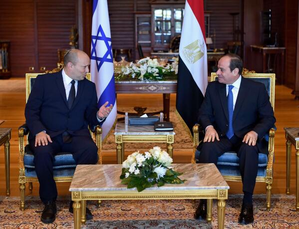 In this photo provided by Egypt's presidency media office, Egyptian President Abdel-Fattah el-Sissi, right, meets with Israeli Prime Minister Naftali Bennett in the Red Sea resort of Sharm el-Sheikh, Egypt, Monday, Sept. 13, 2021. This is the first official visit by an Israeli premier since 2010, when then-President Hosni Mubarak hosted a summit with Benjamin Netanyahu, Palestinian President Mahmoud Abbas and U.S. Secretary of State Hillary Clinton. (Egyptian Presidency Media office via AP)