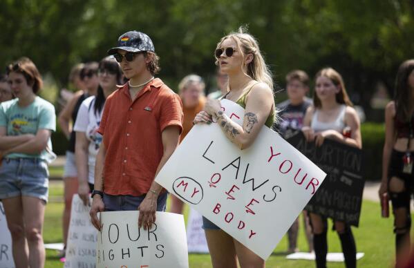 FILE - Community members gather to protest the U.S. Supreme Court's overturning of Roe v. Wade and Kentucky's trigger law to ban abortion, at Circus Square Park in Bowling Green, Ky., on Saturday, June 25, 2022.  (Grace Ramey/Daily News via AP, File)