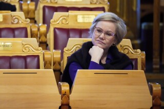 FILE - Minister of Health and Care Ingvild Kjerkol sits in the parliamentary chamber in Oslo, Wednesday Jan. 17, 2024. The center-right opposition in Norway on Thursday called for the resignation of Norway’s Health Minister Ingvild Kjerkol after an academic plagiarism probe ruled that she cheated in her thesis from 2021. It was the latest case of unethical behavior in Prime Minister Jonas Gahr Store's center-left government which took office in October 2021. (Ole Berg-Rusten/NTB via AP, File)