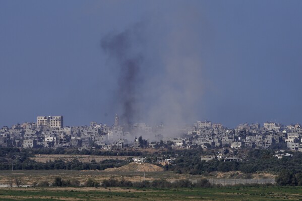 Smoke rises from the battlefield in the Gaza Strip, as seen from southern Israel, Saturday Dec. 30, 2023. The army is battling Palestinian militants across Gaza in the war ignited by Hamas' Oct. 7 attack into Israel.(AP Photo/Tsafrir Abayov)
