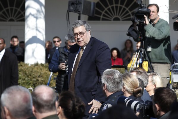 
              Attorney General William Barr stands at the direction of President Donald Trump during an event in the Rose Garden at the White House to declare a national emergency in order to build a wall along the southern border, Friday, Feb. 15, 2019 in Washington. (AP Photo/Pablo Martinez Monsivais)
            