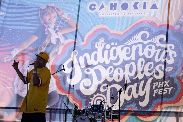 T.O. Mumsigo performs at an Indigenous Peoples Day festival Monday, Oct. 9, 2023, in Phoenix. (AP Photo/Ross D. Franklin)