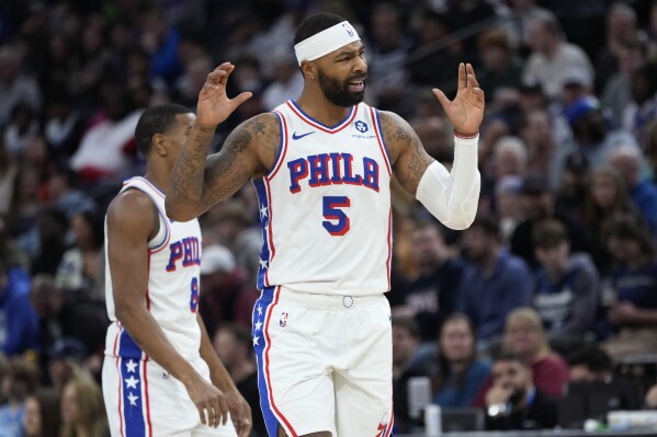 Philadelphia 76ers forward Marcus Morris Sr. (5) reacts after being called for an offensive foul against the Minnesota Timberwolves during the first half of an NBA basketball game Wednesday, Nov. 22, 2023, in Minneapolis. (AP Photo/Abbie Parr)