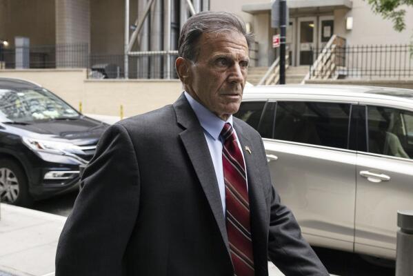 In this July. 27, 2022 photo, retired NYPD detective Louis Scarcella walks towards Kings County Supreme Court, in the Brooklyn borough of New York. In the past nine years, nearly 20 murder and other convictions have been tossed out after defendants accused Scarcella of coercing or inducing false confessions and bogus witness identifications, which he denies. (AP Photo/Yuki Iwamura)
