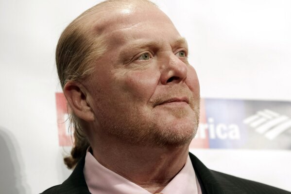 
              FILE - In this Wednesday, April 19, 2017, file photo, chef Mario Batali attends an awards event in New York. The Suffolk County District Attorney’s Office in Boston says Batali is scheduled to be arraigned Friday, May 24, 2019, on a charge of indecent assault and battery, in connection with an allegation that he forcibly kissed and groped a woman at a Boston restaurant in 2017. (Photo by Brent N. Clarke/Invision/AP, File)
            