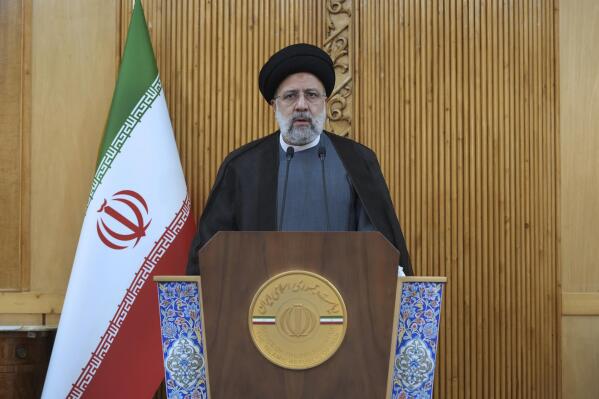 Iranian President Ebrahim Raisi speaks before departing Tehran's Mehrabad airport for a trip to Oman, Monday, May, 23, 2022. (AP Photo/Vahid Salemi)
