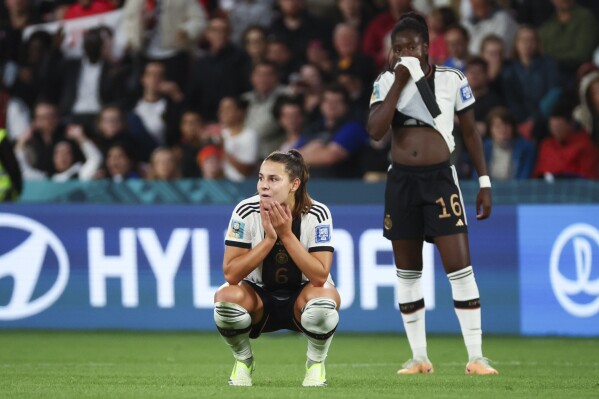 Germany's Lena Oberdorf, left, and teammate Melanie Leupolz react following the Women's World Cup Group H soccer match between South Korea and Germany in Brisbane, Australia, Thursday, Aug. 3, 2023. (AP Photo/Tertius Pickard)