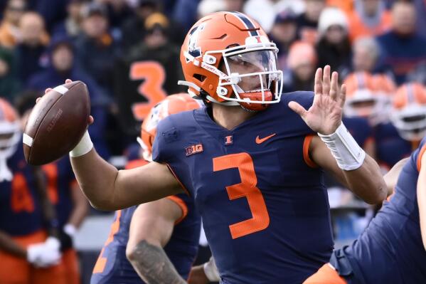 Illinois quarterback Tommy DeVito looks to pass against Michigan State during the first half of an NCAA college football game, Saturday, Nov. 5, 2022, in Champaign, Ill. (AP Photo/Matt Marton)
