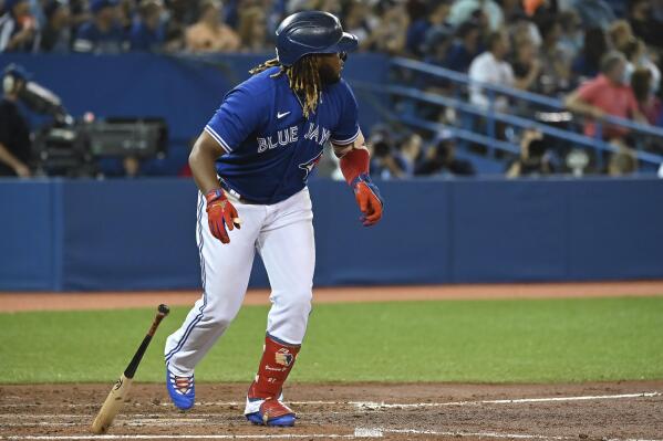 Toronto Blue Jays' Vladimir Guerrero Jr. watches his solo home run against the Minnesota Twins during the third inning of a baseball game Friday, Sept. 17, 2021, in Toronto. (Jon Blacker/The Canadian Press via AP)