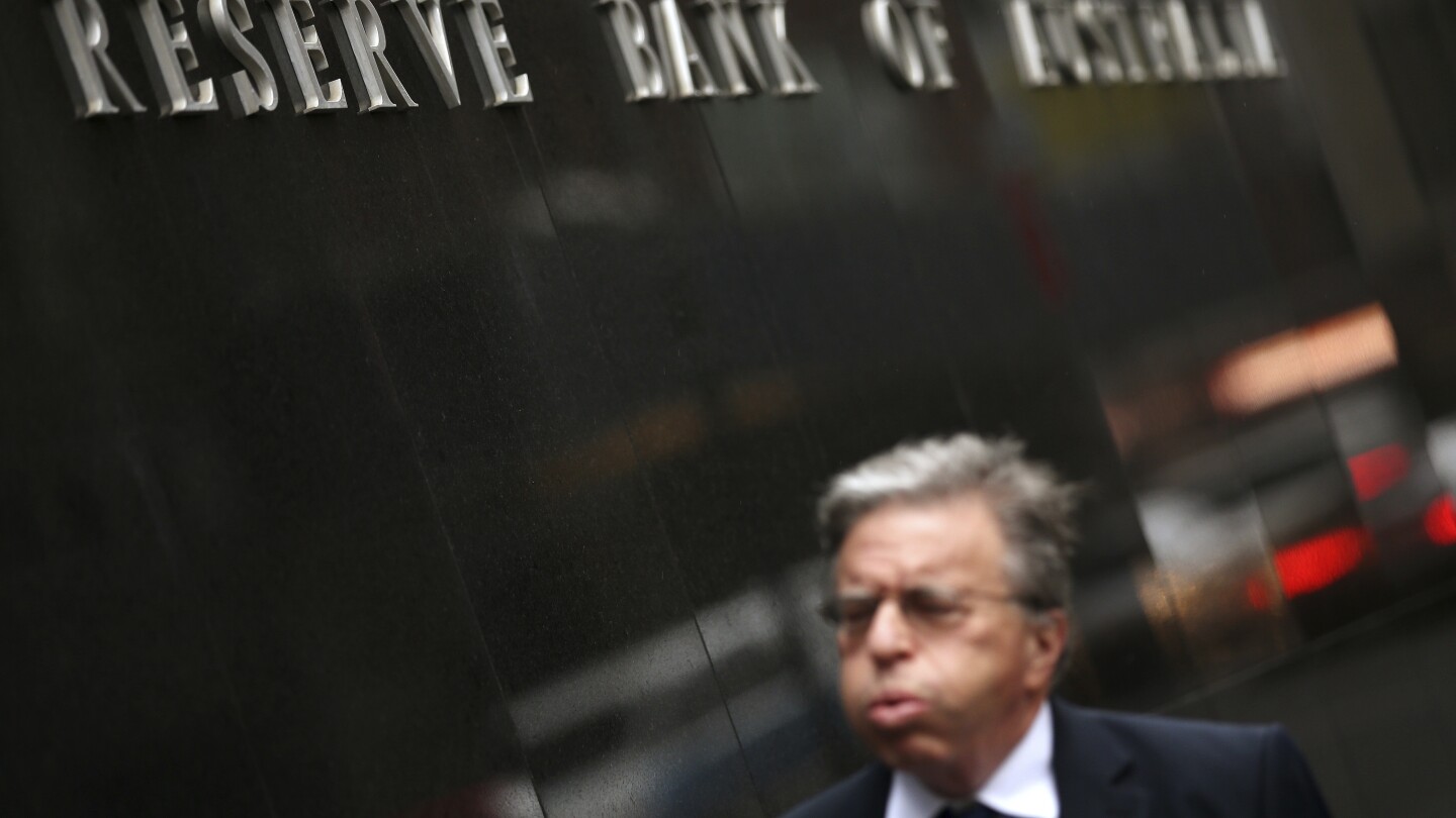 Australian central bank cuts benchmark interest rate for the first time since October 2020