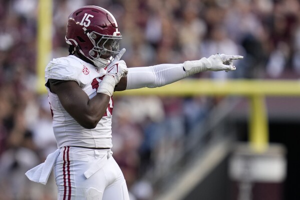 Alabama linebacker Dallas Turner (15) reacts while pointing to the Texas A&M sideline after sacking Texas A&M quarterback Max Johnson (14) during the third quarter of an NCAA college football game Saturday, Oct. 7, 2023, in College Station, Texas. (AP Photo/Sam Craft)