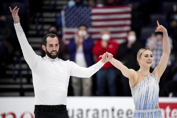 Ashley Cain-Gribble, right, and Timothy LeDuc acknowledge the applause during the pairs short program competition at the U.S. Figure Skating Championships Thursday, Jan. 6, 2022, in Nashville, Tenn. (Andrew Nelles/The Tennessean via AP)