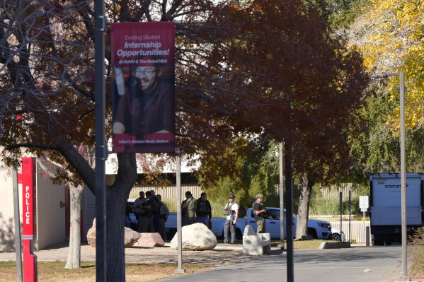 Las Vegas Metro Police respond to a shooting reported on the University of Nevada, Las Vegas, campus, Wednesday, Dec. 6, 2023, in Las Vegas. (AP Photo/Lucas Peltier)