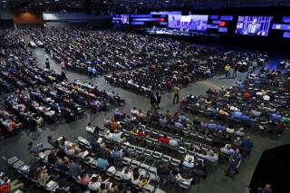 FILE - In this Wednesday, June 16, 2021 file photo, people attend the morning session of the Southern Baptist Convention annual meeting in Nashville, Tenn. On Tuesday, Oct. 5, 2021, a top committee of the SBC agreed to open up legally protected records to investigators who will look into how it handled, or mishandled, cases of sexual abuse within the nation's largest Protestant denomination over the past two decades. (AP Photo/Mark Humphrey, File)